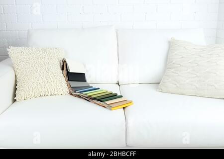 Scraps of colored tissue on sofa close up Stock Photo