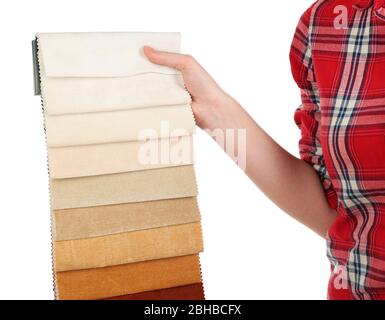 Female hand holding scraps of colored tissue isolated on white Stock Photo