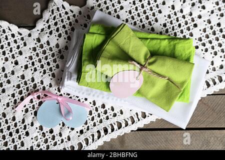 Napkins with Easter decorations  on wooden background Stock Photo