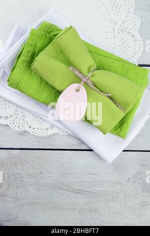 Napkins with Easter decorations  on wooden background Stock Photo