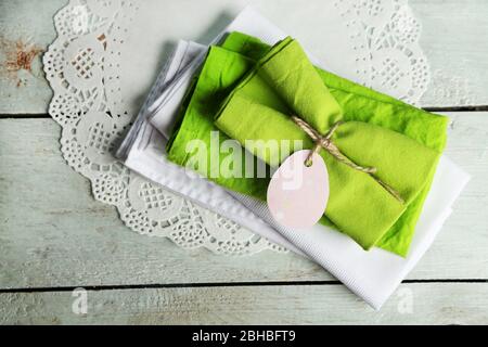 Napkins with Easter decorations  on wooden background Stock Photo