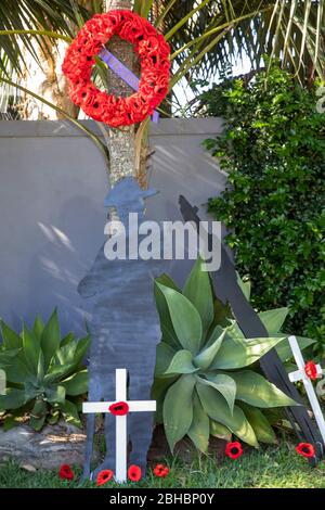 Avalon Beach, Sydney, Australia. Saturday 25th  April  2020, With traditional ANZAC Day marches and parades cancelled across Australia due to COVID-19 risks, many Sydney residents are celebrating ANZAC Day at home displaying national flags and Lest We Forget crosses at the end of driveways. Credit Martin Berry/Alamy Live News Stock Photo