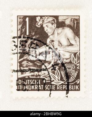 SEATTLE WASHINGTON - April 23, 2020: 1953 East German Stamp featuring a  coal miner, a stamp of the Five-Year Plan,. Scott # 155 Stock Photo