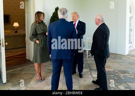 Washington, United States Of America. 22nd Apr, 2020. President Donald J. Trump and First Lady Melania Trump talk with Agriculture Secretary Sonny Perdue and House Minority Leader Rep. Kevin McCarthy, R-Calif., on the Colonnade of the White House Wednesday, April 22, 2020, after participating in a tree planting ceremony on the South Lawn in honor of Earth Day and Arbor Day People: President Donald Trump Credit: Storms Media Group/Alamy Live News Stock Photo