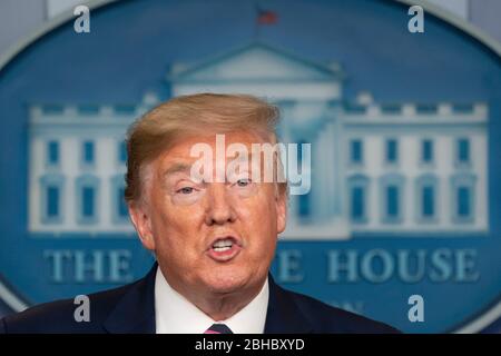 United States President Donald Trump participates in a news briefing with members of the Coronavirus Task Force at the White House in Washington, DC on April 24, 2020. Credit: Chris Kleponis/Pool via CNP Stock Photo