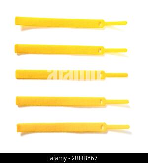 yellow velcro cable ties on white background Stock Photo