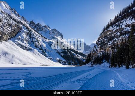 rocky mountains around frozen lake louise winter wonderland. Stock Photo