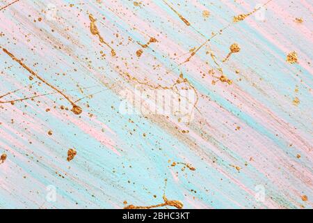 Diagonal pink and blue background with Random gold paint splashes. Place for your design. Stock Photo