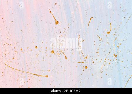 Delicate pink and blue background with gold paint splashes. Place for your design. Stock Photo