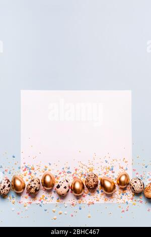 Happy easter greeting card. Creative layout made of square paper and golden egg border. Place for congratulation text. Stock Photo
