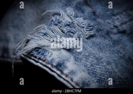 Close-up popular trend ripped jeans or distressed jeans Stock Photo