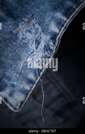 Close-up popular trend ripped jeans or distressed jeans Stock Photo