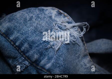 Close-up popular trend ripped jeans or distressed jeans Stock Photo