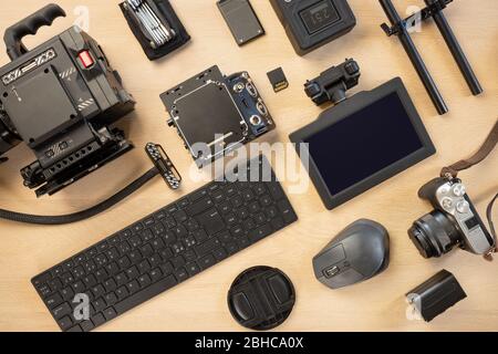 Directly above shot of computer parts and photographic equipment on table Stock Photo