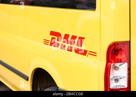 BERLIN - APR 23: Yellow DHL Logo on DHL truck in Berlin on April 23. 2020 in Germany Stock Photo