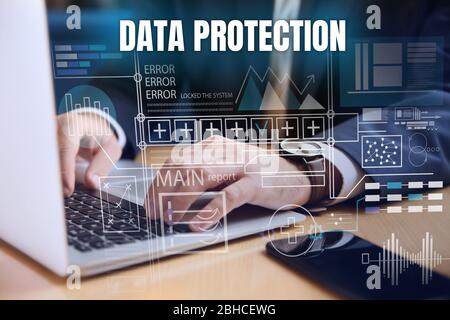Businessman working with laptop, closeup. Concept of data protection Stock Photo
