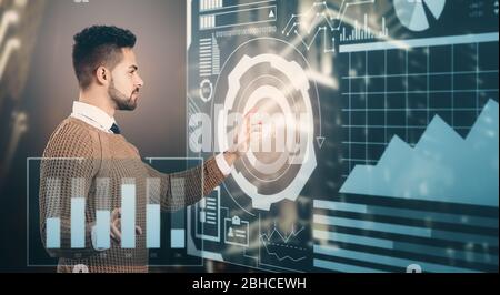 Double exposure of businessman using virtual screen and modern city. Concept of business data Stock Photo