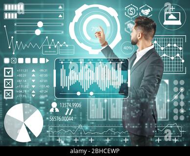 Double exposure of businessman using virtual screen and modern city. Concept of business data Stock Photo
