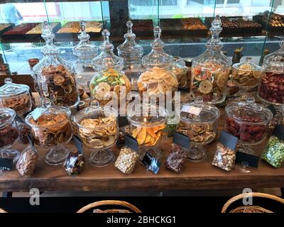 Assorted Dried Fruits in Glass Bowls in Shop / Bazaar for Sale. Healthy Snacks. Stock Photo