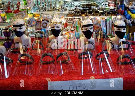 Black face masks and face shields for Coronavirus epidemic protection on a street stall vendor desk in Istanbul, Turkey. Stock Photo