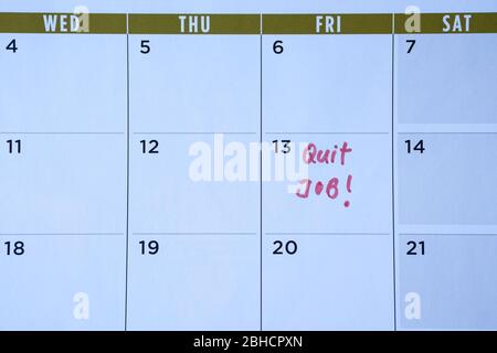 Quit job words written on table calendar with red marker. Employment or careers concept. Stock Photo