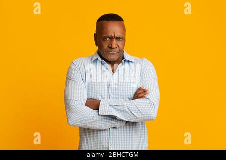 Grumpy mature african american man looking at camera Stock Photo