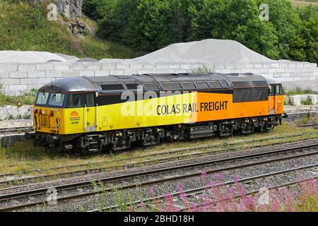 A British Rail Class 56 Type 5 diesel locomotive 56105 belonging to Colas Rail freight outside Dove Holes limestone quarry, Derbyshire, England, UK Stock Photo