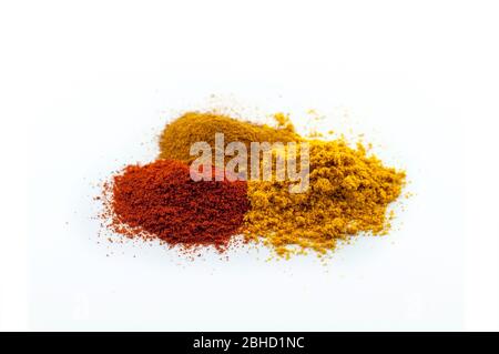 Mix of different powders like paprica and curry isolated on white background Stock Photo