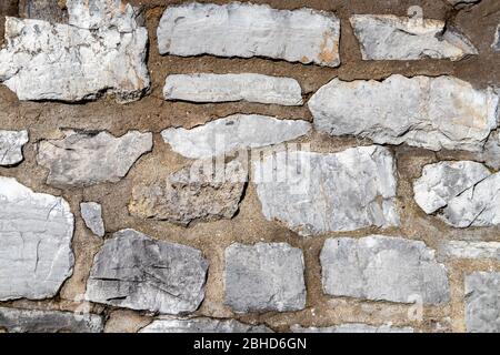 Grey stone wall from an historic castle in Germany as texture and background Stock Photo