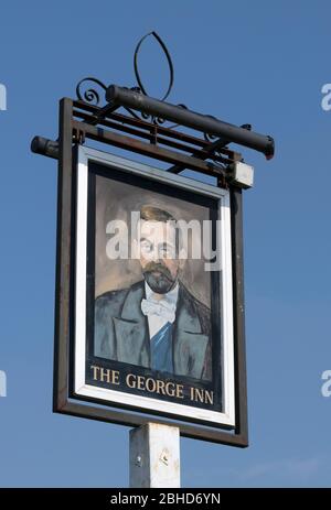 Hanging pub sign at The George inn, The Crossroads, Farley St, Middle Wallop, Stockbridge, Hampshire, England, UK Stock Photo