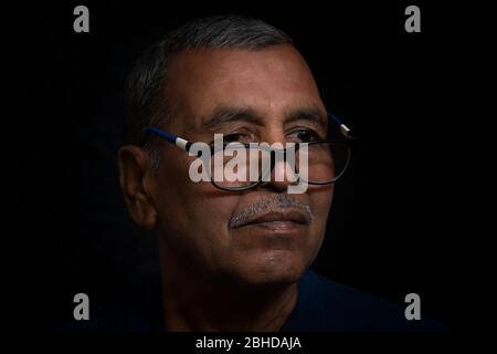 Portrait of thinking senior man thinking. India Stock Photo