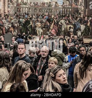 Pais, France, Febuary 21, 2020,  Dense crowd of tourists in the Louvre museum, in front of 'Les noces de Cana' . Large number of unidentified people Stock Photo