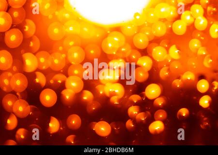 Nice orange bokeh abstract background simulating magic light particles. Stock Photo