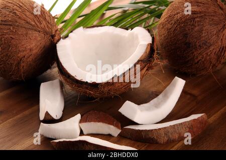 Coconut products with fresh coconut, Coconut flakes, coconut spa oil. Ripe coconut fruits Stock Photo