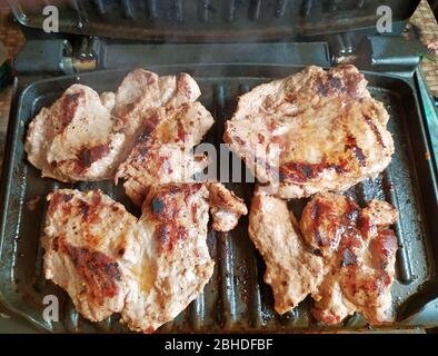 Steaks cooked on an electric grill. Healthy eating concept Stock Photo