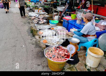 The fresh fish shop on the street with its vendor showing original Thai lifestyle at Prachuabkirikhan Thailand June 10, 2017 Stock Photo