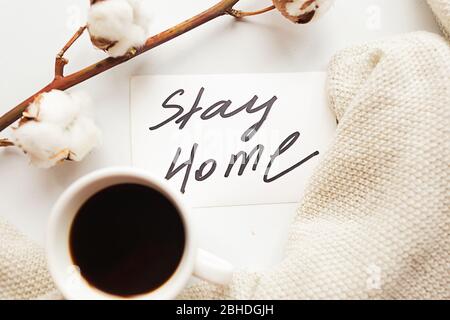 https://l450v.alamy.com/450v/2bhdgjh/flat-lay-photo-with-coffee-cup-and-card-with-message-stay-home-on-white-background-quarantine-concept-2bhdgjh.jpg