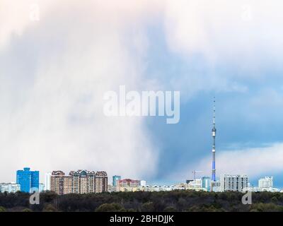 large rainy clouds over apartment houses in Moscow city in spring Stock Photo