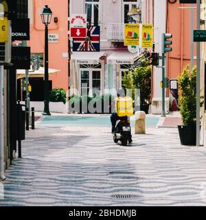 Glovo delivery driver in Cascais, Portugal Stock Photo