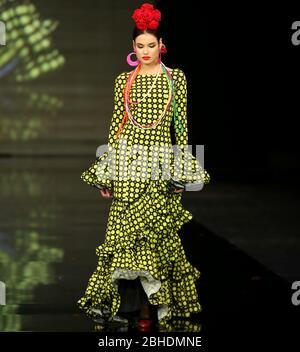 SEVILLA, SPAIN - JAN 30: Model wearing a dress from the Laranjeira collection by designer Pilar Vera as part of the SIMOF 2020 (Photo credit: Mickael Chavet)