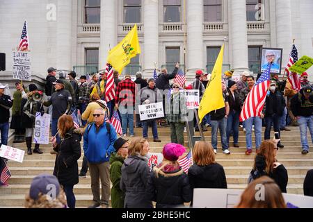 Wisconsinites rallied at the Capitol of Wisconsin protest against safer at home order due to the Coronavirus pandemic to allow the state reopen. Stock Photo