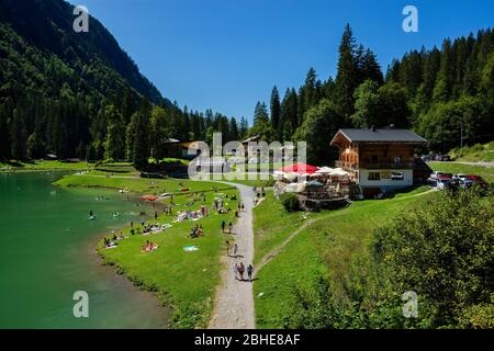 Montriond, France - August, 8, 2019. Lake of Montriond, natural lake in Portes du Soleil, Haute-Savoie region, France, an attraction for many tourists Stock Photo
