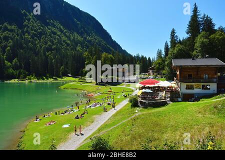Montriond, France - August, 8, 2019. Lake of Montriond, natural lake in Portes du Soleil, Haute-Savoie region, France, an attraction for many tourists Stock Photo