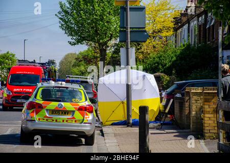 London, UK. 25th Apr, 2020. A man has died in a house fire in Earlsfield. Firefighters were called to the house on Burntwood Lane at 7.36am on Saturday, April 25 and had the fire under control by 8.33am. The fire crew found a man in a ground floor bedroom and brought him out of the house, but he died at the scene. Credit: JOHNNY ARMSTEAD/Alamy Live News Stock Photo