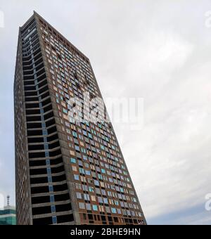 Modern building construction with curved diagonal shape in Kyiv downtown district Stock Photo