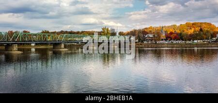 Panoramic fall scene of a bridge across the Delaware River from Bucks County, PA looking toward New Jersey Stock Photo