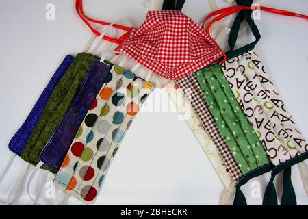 Various styles of homemade multicolored cloth face masks Stock Photo