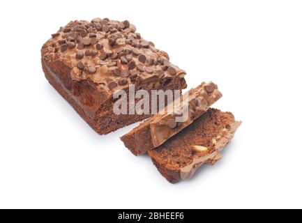 Studio shot of a sliced chocolate fudge cake cut out against a white background - John Gollop Stock Photo