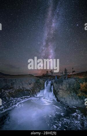 Orchon waterfall at night with starry sky and Milky Way, Uvurkhangai Province, Mongolia, Asia Stock Photo