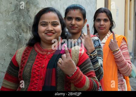 indian woman voters showing voter mark on finger after polling Stock Photo